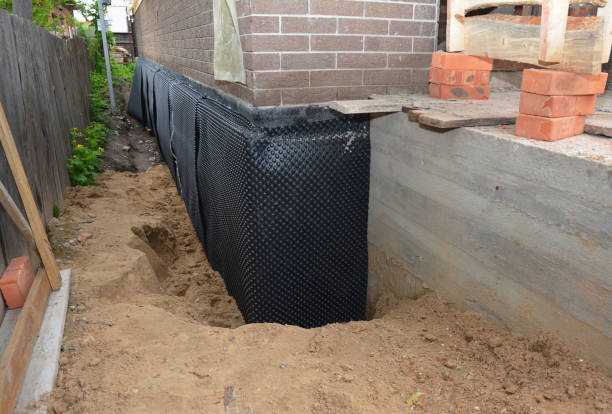 SJ Waterproofing Pros technician performing targeted Waterproofing assessment in Buford, GA